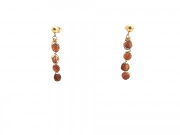 Gouden oorstekers zonnesteen